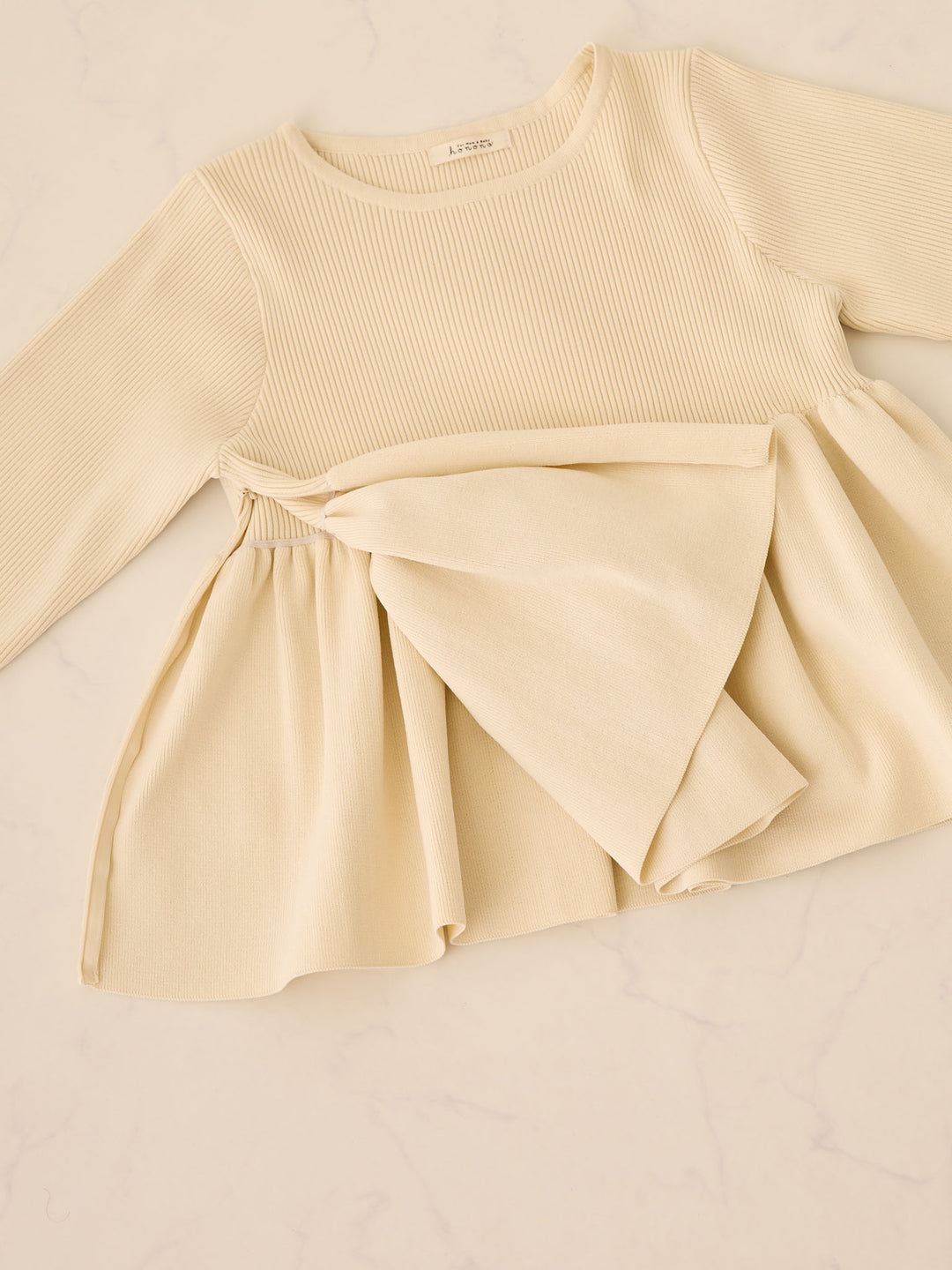 ペプラムニットトップス Ivory